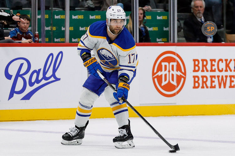 Jan 2, 2025; Denver, Colorado, USA; Buffalo Sabres left wing Jason Zucker (17) controls the puck in the first period against the Colorado Avalanche at Ball Arena. Credit: Isaiah J. Downing-Imagn Images