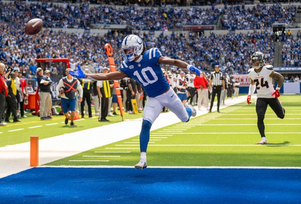 Sep 8, 2024; Indianapolis, Indiana, USA; Indianapolis Colts wide receiver Adonai Mitchell (10) reaches for an overthrown pass in front of Houston Texans cornerback Derek Stingley Jr. (24) during the second quarter at Lucas Oil Stadium. Mandatory Credit: Marc Lebryk-Imagn Images