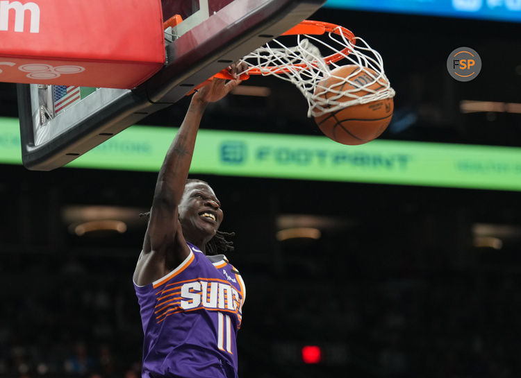 Feb 8, 2025; Phoenix, Arizona, USA; Phoenix Suns center Bol Bol (11) dunks against the Denver Nuggets during the first half at Footprint Center. Credit: Joe Camporeale-Imagn Images