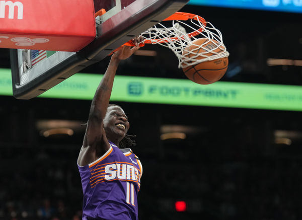 Feb 8, 2025; Phoenix, Arizona, USA; Phoenix Suns center Bol Bol (11) dunks against the Denver Nuggets during the first half at Footprint Center. Mandatory Credit: Joe Camporeale-Imagn Images