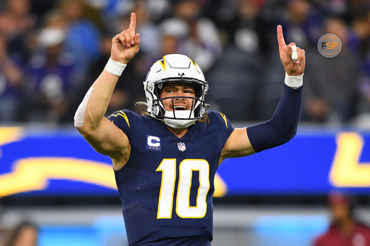 INGLEWOOD, CA - NOVEMBER 26: Los Angeles Chargers quarterback Justin Herbert (10) celebrates during the NFL regular season game between the Baltimore Ravens and the Los Angeles Chargers on November 26, 2023, at SoFi Stadium in Inglewood, CA. (Photo by Brian Rothmuller/Icon Sportswire)