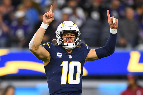 INGLEWOOD, CA - NOVEMBER 26: Los Angeles Chargers quarterback Justin Herbert (10) celebrates during the NFL regular season game between the Baltimore Ravens and the Los Angeles Chargers on November 26, 2023, at SoFi Stadium in Inglewood, CA. (Photo by Brian Rothmuller/Icon Sportswire)