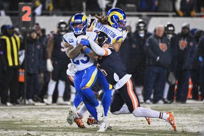 Jan 18, 2026; Chicago, IL, USA; Los Angeles Rams running back Kyren Williams (23) runs with the ball against Chicago Bears cornerback Kyler Gordon (6) during the second quarter of an NFC Divisional Round game at Soldier Field. Mandatory Credit: Matt Marton-Imagn Images