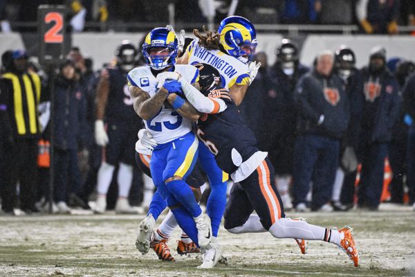 Jan 18, 2026; Chicago, IL, USA; Los Angeles Rams running back Kyren Williams (23) runs with the ball against Chicago Bears cornerback Kyler Gordon (6) during the second quarter of an NFC Divisional Round game at Soldier Field. Mandatory Credit: Matt Marton-Imagn Images