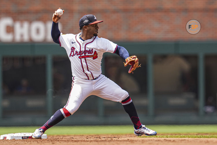 May 15, 2025; Cumberland, Georgia, USA; Atlanta Braves second base Ozzie Albies (1) throws for a double play against the Washington Nationals during the second inning at Truist Park. Credit: Dale Zanine-Imagn Images