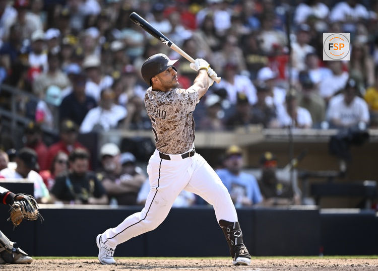 Aug 3, 2025; San Diego, California, USA; San Diego Padres right fielder Ramon Laureano (5) hits a solo home run during the eighth inning against the St. Louis Cardinals at Petco Park. Credit: Denis Poroy-Imagn Images