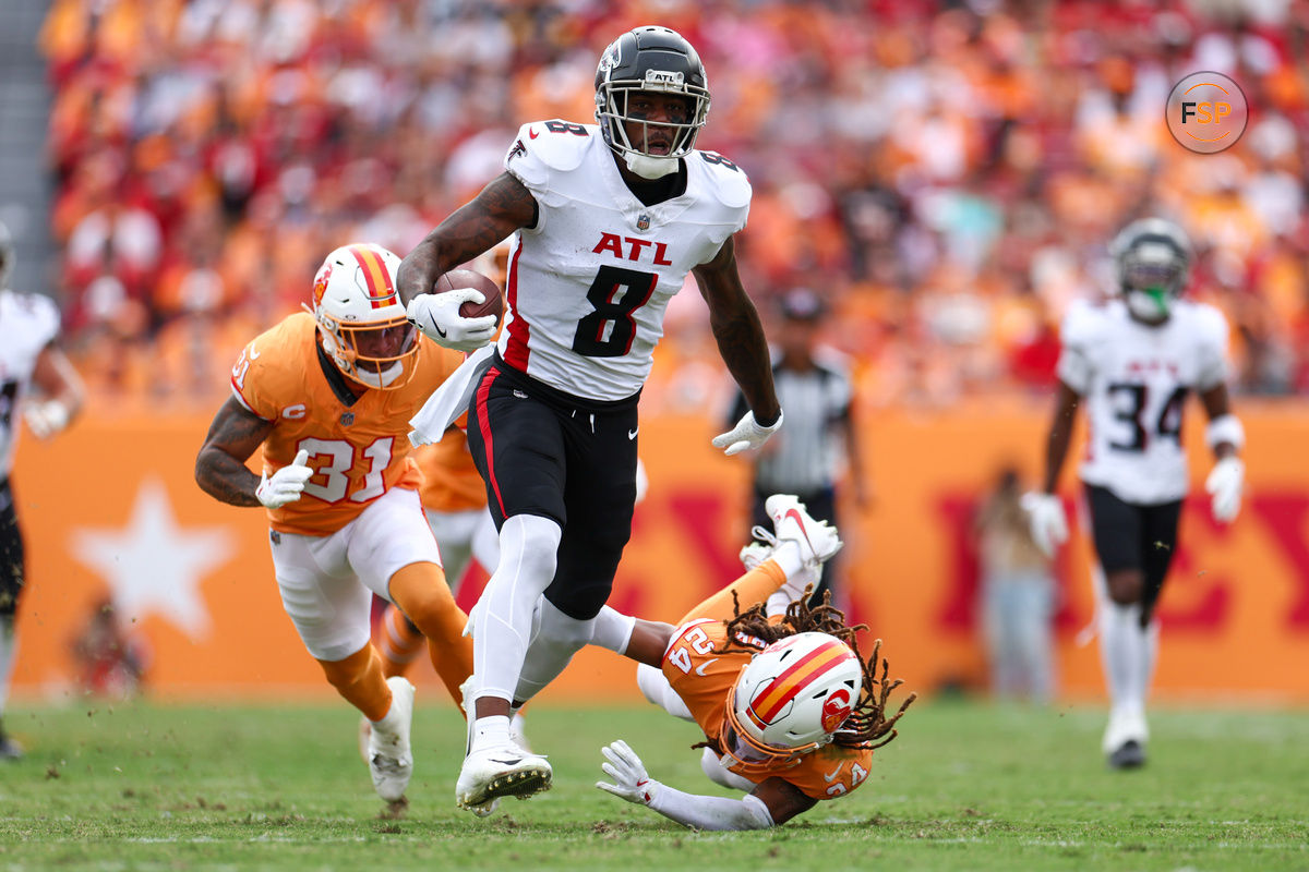 Oct 27, 2024; Tampa, Florida, USA;Atlanta Falcons tight end Kyle Pitts (8) holds off Tampa Bay Buccaneers cornerback Tyrek Funderburk (24) in the second quarter  at Raymond James Stadium. Credit: Nathan Ray Seebeck-Imagn Images