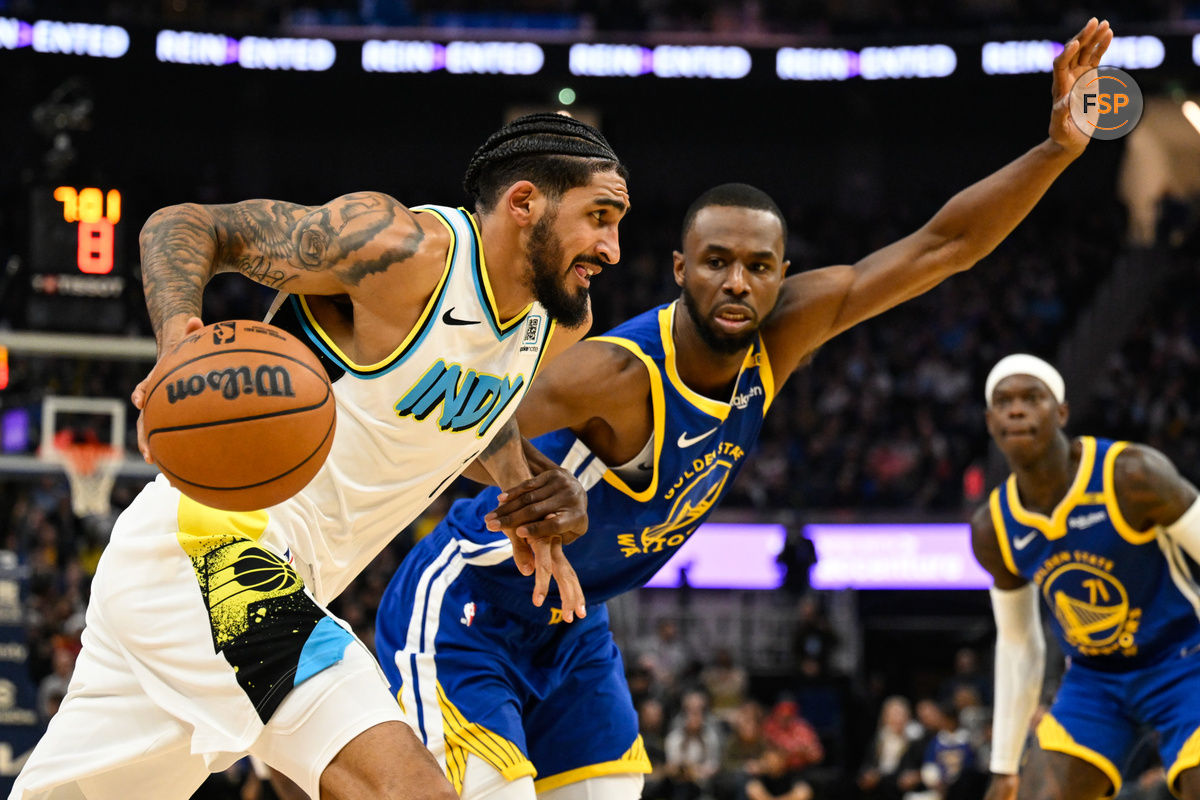 Dec 23, 2024; San Francisco, California, USA; Indiana Pacers forward Obi Toppin (1) drives to the basket against Golden State Warriors forward Andrew Wiggins (22) in the second quarter at Chase Center. Credit: Eakin Howard-Imagn Images