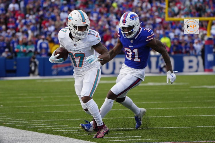 Nov 3, 2024; Orchard Park, New York, USA; Miami Dolphins wide receiver Jaylen Waddle (17) makes a catch against Buffalo Bills cornerback Rasul Douglas (31) during the second half at Highmark Stadium. Credit: Gregory Fisher-Imagn Images