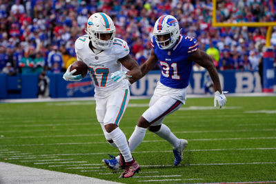 Nov 3, 2024; Orchard Park, New York, USA; Miami Dolphins wide receiver Jaylen Waddle (17) makes a catch against Buffalo Bills cornerback Rasul Douglas (31) during the second half at Highmark Stadium. Mandatory Credit: Gregory Fisher-Imagn Images