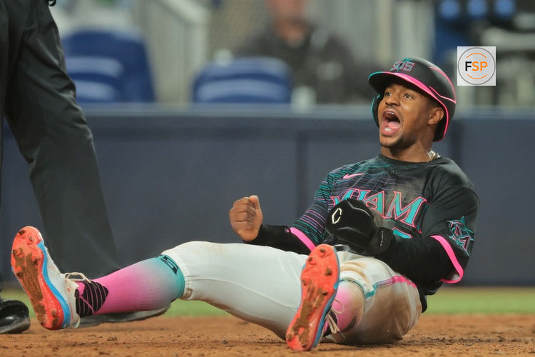 Jul 5, 2025; Miami, Florida, USA; Miami Marlins second baseman Xavier Edwards (9) reacts after scoring against the Milwaukee Brewers during the eighth inning at loanDepot Park. Credit: Sam Navarro-Imagn Images