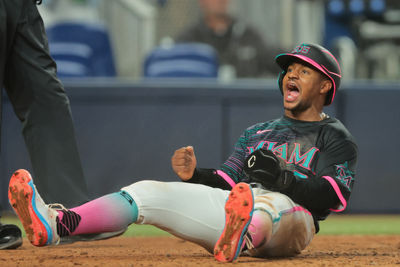 Jul 5, 2025; Miami, Florida, USA; Miami Marlins second baseman Xavier Edwards (9) reacts after scoring against the Milwaukee Brewers during the eighth inning at loanDepot Park. Mandatory Credit: Sam Navarro-Imagn Images
