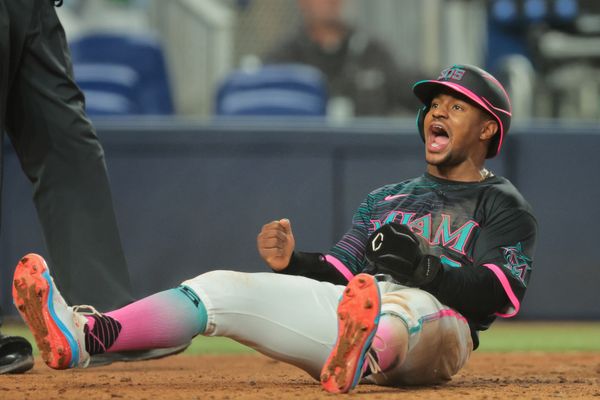 Jul 5, 2025; Miami, Florida, USA; Miami Marlins second baseman Xavier Edwards (9) reacts after scoring against the Milwaukee Brewers during the eighth inning at loanDepot Park. Mandatory Credit: Sam Navarro-Imagn Images