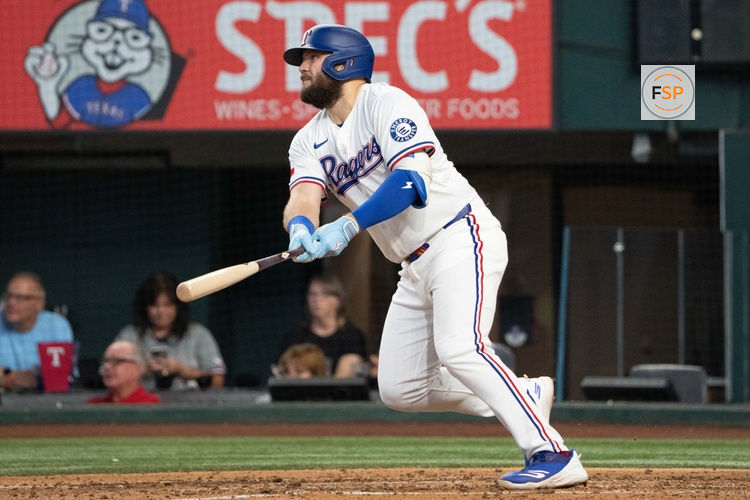 Sep 10, 2025; Arlington, Texas, USA; Texas Rangers first baseman Jake Burger (21) watches his two-run home run against the Milwaukee Brewers during the fifth inning at Globe Life Field. Credit: Jim Cowsert-Imagn Images