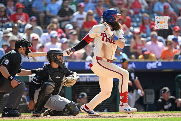 Jun 7, 2026; Philadelphia, Pennsylvania, USA; Philadelphia Phillies left fielder Brandon Marsh (16) watches his RBI single against the Chicago White Sox during the sixth inning at Citizens Bank Park. Credit: Eric Hartline-Imagn Images