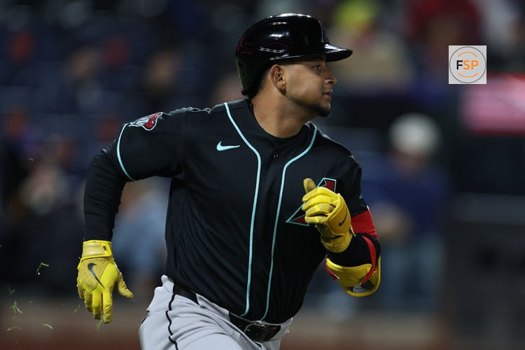 Apr 9, 2026; New York City, New York, USA;  Arizona Diamondbacks catcher Gabriel Moreno (14) hits an RBI double during the eighth inning against the New York Mets at Citi Field. Credit: Vincent Carchietta-Imagn Images