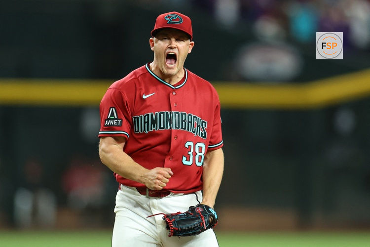 May 23, 2026; Phoenix, Arizona, USA; Arizona Diamondbacks relief pitcher Paul Sewald (38) reacts after defeating the Colorado Rockies in the ninth inning at Chase Field. Credit: Anna Carrington-Imagn Images