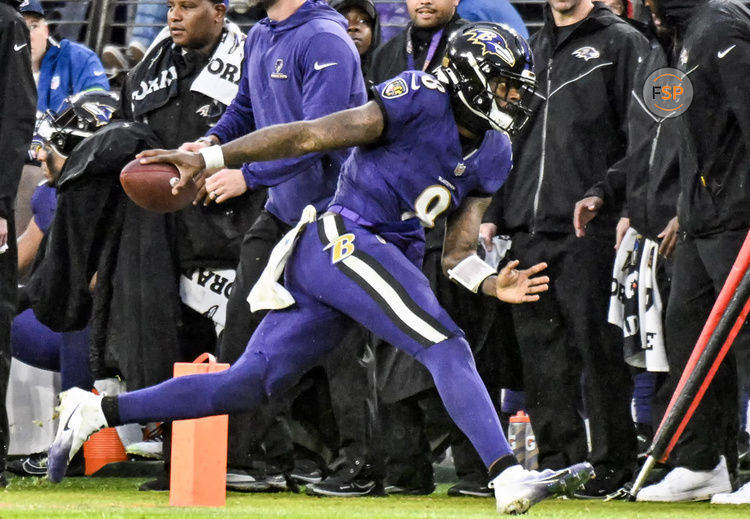 BALTIMORE, MD - DECEMBER 10:  Baltimore Ravens quarterback Lamar Jackson (8) runs out of bounds during the Los Angeles Rams game versus the Baltimore Ravens on December 10, 2023 at M&T Bank Stadium in Baltimore, MD.   (Photo by Mark Goldman/Icon Sportswire)