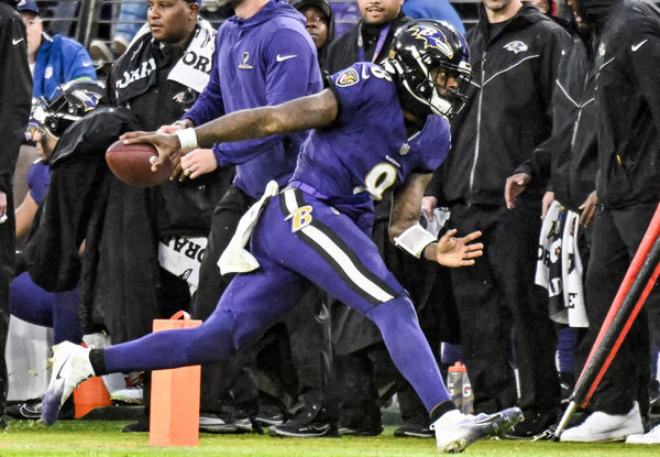 BALTIMORE, MD - DECEMBER 10:  Baltimore Ravens quarterback Lamar Jackson (8) runs out of bounds during the Los Angeles Rams game versus the Baltimore Ravens on December 10, 2023 at M&T Bank Stadium in Baltimore, MD.   (Photo by Mark Goldman/Icon Sportswire)