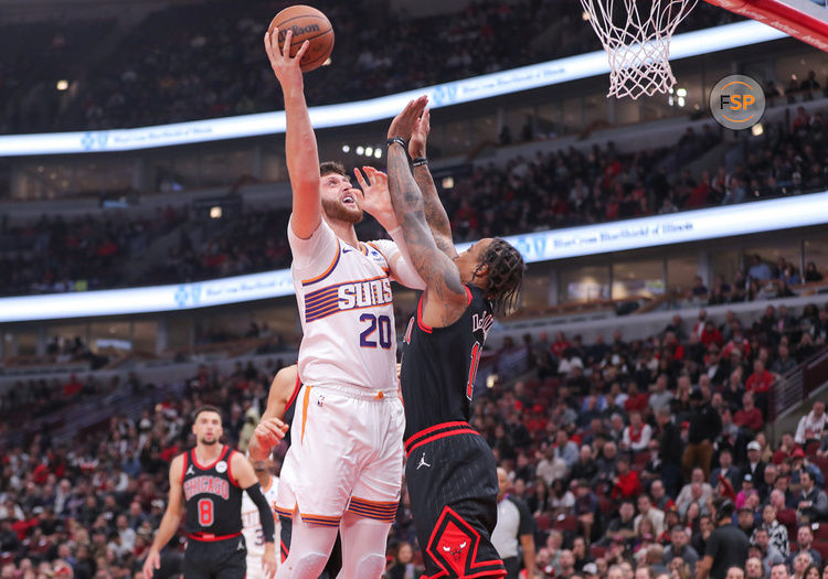 CHICAGO, IL - NOVEMBER 08: DeMar DeRozan #11 of the Chicago Bulls and Jusuf Nurkic #20 of the Phoenix Suns in action during the first half at the United Center on November 8, 2023 in Chicago, Illinois. (Photo by Melissa Tamez/Icon Sportswire)