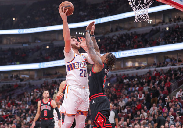 CHICAGO, IL - NOVEMBER 08: DeMar DeRozan #11 of the Chicago Bulls and Jusuf Nurkic #20 of the Phoenix Suns in action during the first half at the United Center on November 8, 2023 in Chicago, Illinois. (Photo by Melissa Tamez/Icon Sportswire)