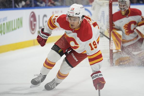 Oct 28, 2025; Toronto, Ontario, CAN; Calgary Flames defenseman Zayne Parekh (19) skates against the Toronto Maple Leafs during the first period at Scotiabank Arena. Mandatory Credit: John E. Sokolowski-Imagn Images