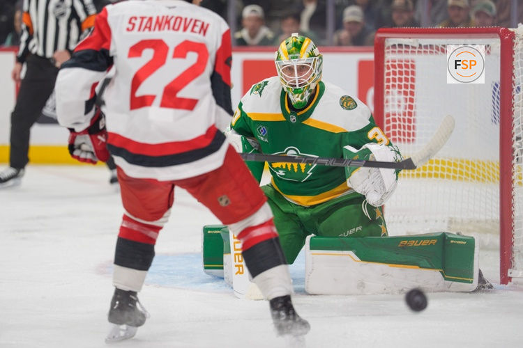 Nov 19, 2025; Saint Paul, Minnesota, USA; Minnesota Wild goaltender Jesper Wallstedt (30) makes a save on Carolina Hurricanes center Logan Stankoven (22) in the first period at Grand Casino Arena. Credit: Matt Blewett-Imagn Images