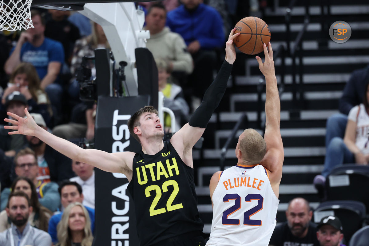 Nov 12, 2024; Salt Lake City, Utah, USA; Utah Jazz forward Kyle Filipowski (22) blocks the shot of Phoenix Suns center Mason Plumlee (22) during the fourth quarter at Delta Center. Credit: Rob Gray-Imagn Images