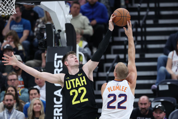 Nov 12, 2024; Salt Lake City, Utah, USA; Utah Jazz forward Kyle Filipowski (22) blocks the shot of Phoenix Suns center Mason Plumlee (22) during the fourth quarter at Delta Center. Mandatory Credit: Rob Gray-Imagn Images