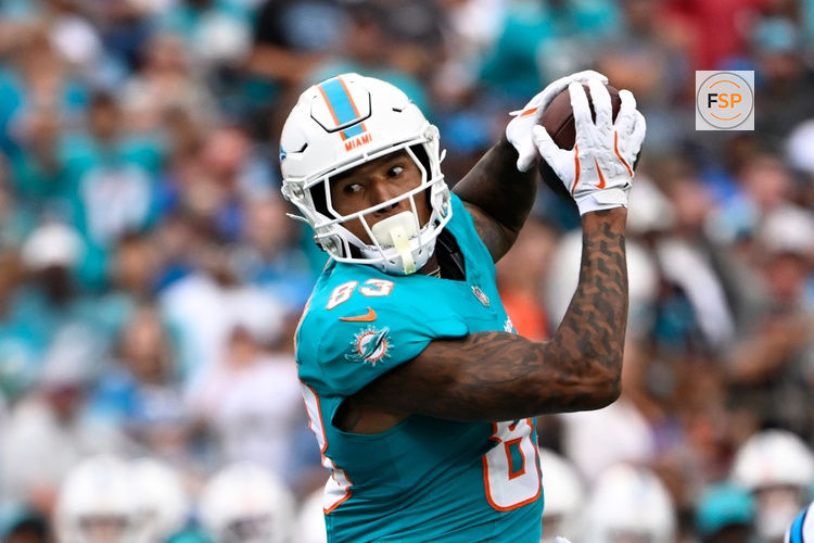 Oct 5, 2025; Charlotte, North Carolina, USA; Miami Dolphins tight end Darren Waller (83) catches the ball in the first quarter at Bank of America Stadium. Credit: Bob Donnan-Imagn Images