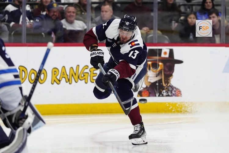 Dec 19, 2025; Denver, Colorado, USA; Colorado Avalanche right wing Valeri Nichushkin (13) shoots the puck in the second period against the Winnipeg Jets at Ball Arena. Credit: Ron Chenoy-Imagn Images