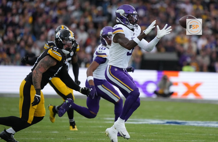 Sep 28, 2025; Dublin, Ireland; Minnesota Vikings wide receiver Jordan Addison (3) catches a pass under pressure from Pittsburgh Steelers linebacker Nick Herbig (51) during the second quarter during an NFL International Series game at Croke Park. Credit: Kirby Lee-Imagn Images