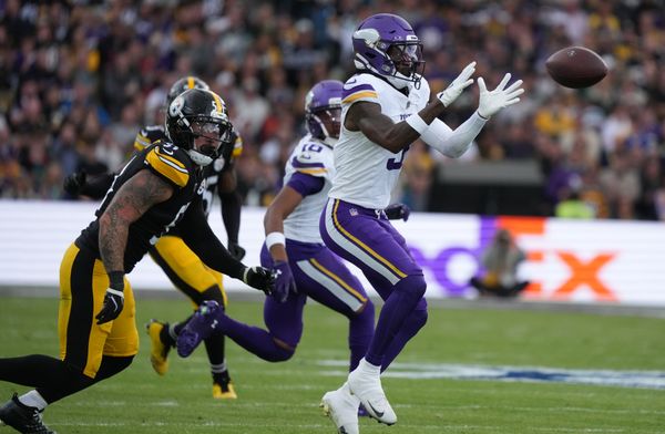 Sep 28, 2025; Dublin, Ireland; Minnesota Vikings wide receiver Jordan Addison (3) catches a pass under pressure from Pittsburgh Steelers linebacker Nick Herbig (51) during the second quarter during an NFL International Series game at Croke Park. Mandatory Credit: Kirby Lee-Imagn Images