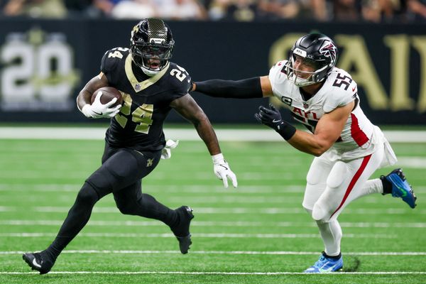 Nov 23, 2025; New Orleans, Louisiana, USA; New Orleans Saints running back Devin Neal (24) carries the ball as Atlanta Falcons linebacker Kaden Elliss (55) defends during the second half at Caesars Superdome. Mandatory Credit: Stephen Lew-Imagn Images