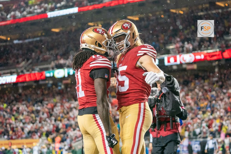 January 20, 2024; Santa Clara, CA, USA; San Francisco 49ers tight end George Kittle (85) is congratulated by wide receiver Brandon Aiyuk (11) after scoring a touchdown during the second quarter in a 2024 NFC divisional round game against the Green Bay Packers at Levi's Stadium. Credit: Kyle Terada-USA TODAY Sports