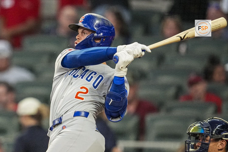 Sep 10, 2025; Cumberland, Georgia, USA; Chicago Cubs second baseman Nico Hoerner (2) singles against the Atlanta Braves during the third inning at Truist Park. Credit: Dale Zanine-Imagn Images