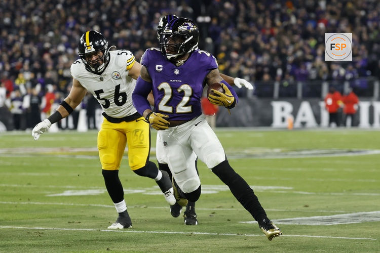 Jan 11, 2025; Baltimore, Maryland, USA; Baltimore Ravens running back Derrick Henry (22) runs against Pittsburgh Steelers linebacker Alex Highsmith (56) in the second quarter in an AFC wild card game at M&T Bank Stadium. Credit: Geoff Burke-Imagn Images