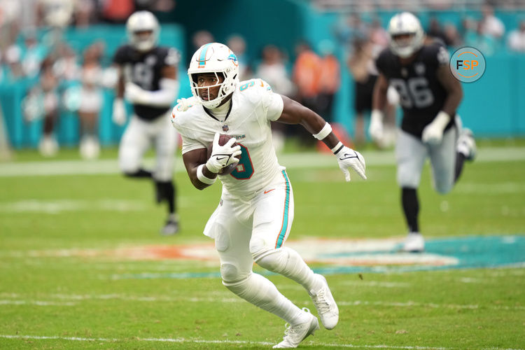 Nov 17, 2024; Miami Gardens, Florida, USA; Miami Dolphins tight end Jonnu Smith (9) breaks free for a touchdown late in the fourth quarter against the Las Vegas Raiders at Hard Rock Stadium. Credit: Jim Rassol-Imagn Images