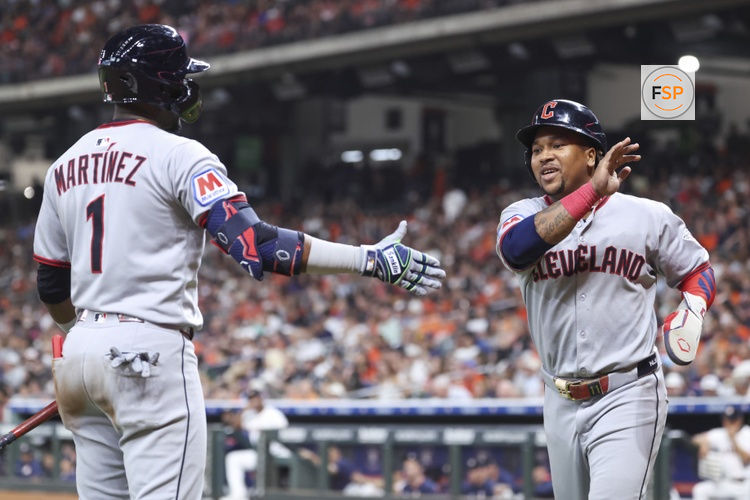 Jul 8, 2025; Houston, Texas, USA; Cleveland Guardians designated hitter Jose Ramirez (11) celebrates with second baseman Angel Martinez (1) after scoring during the third inning against the Houston Astros at Daikin Park. Credit: Troy Taormina-Imagn Images