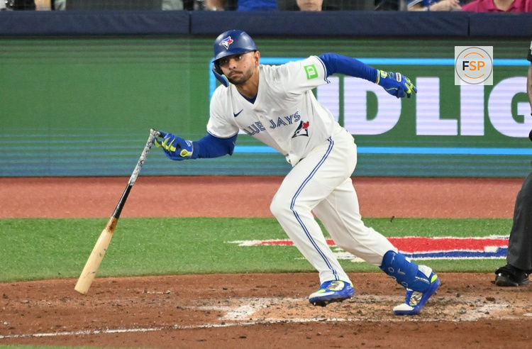 Apr 19, 2025; Toronto, Ontario, CAN;  Toronto Blue Jays second baseman Andres Gimenez (0) hits a single against the Seattle Mariners in the fifth inning at Rogers Centre. Credit: Dan Hamilton-Imagn Images