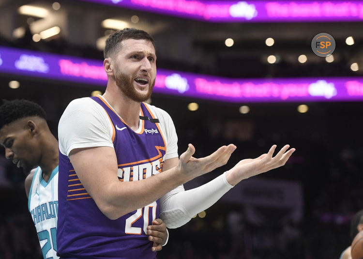 Jan 7, 2025; Charlotte, North Carolina, USA;  Phoenix Suns center Jusuf Nurkic (20) reacts after being called on a foul during the second half against the Charlotte Hornets at the Spectrum Center. Credit: Sam Sharpe-Imagn Images