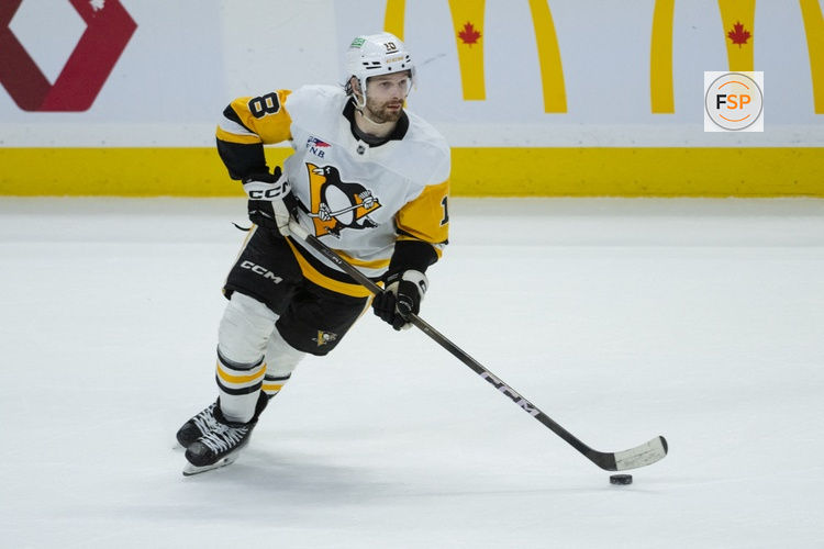 Mar 26, 2026; Ottawa, Ontario, CAN; Pittsburgh Penguins center Thomas Novak (18) skates with the puck in overtime against the Ottawa Senators at the Canadian Tire Centre. Credit: Marc DesRosiers-IMAGN Images