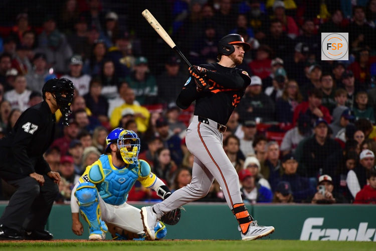 May 24, 2025; Boston, Massachusetts, USA;  Baltimore Orioles right fielder Ryan O'Hearn (32) hits an RBI single during the eighth inning against the Boston Red Sox at Fenway Park. Credit: Bob DeChiara-Imagn Images