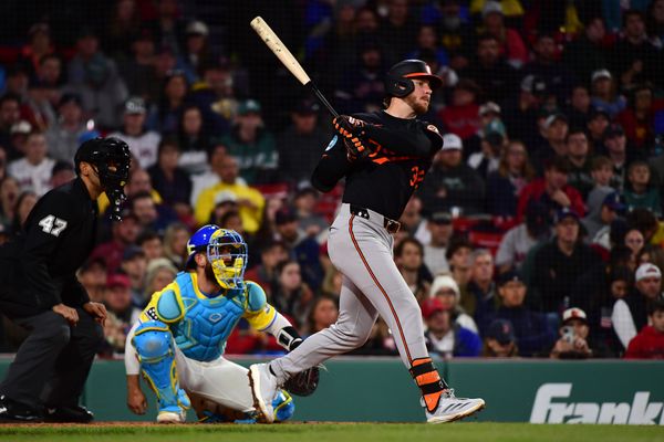 May 24, 2025; Boston, Massachusetts, USA;  Baltimore Orioles right fielder Ryan O'Hearn (32) hits an RBI single during the eighth inning against the Boston Red Sox at Fenway Park. Mandatory Credit: Bob DeChiara-Imagn Images