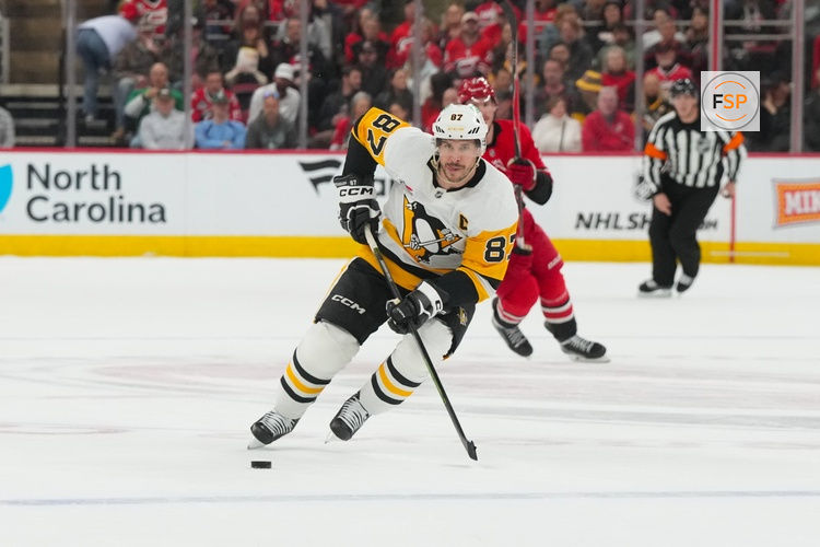 Mar 18, 2026; Raleigh, North Carolina, USA;  Pittsburgh Penguins center Sidney Crosby (87) skates with the puck against the Carolina Hurricanes during the second period at Lenovo Center. Credit: James Guillory-Imagn Images