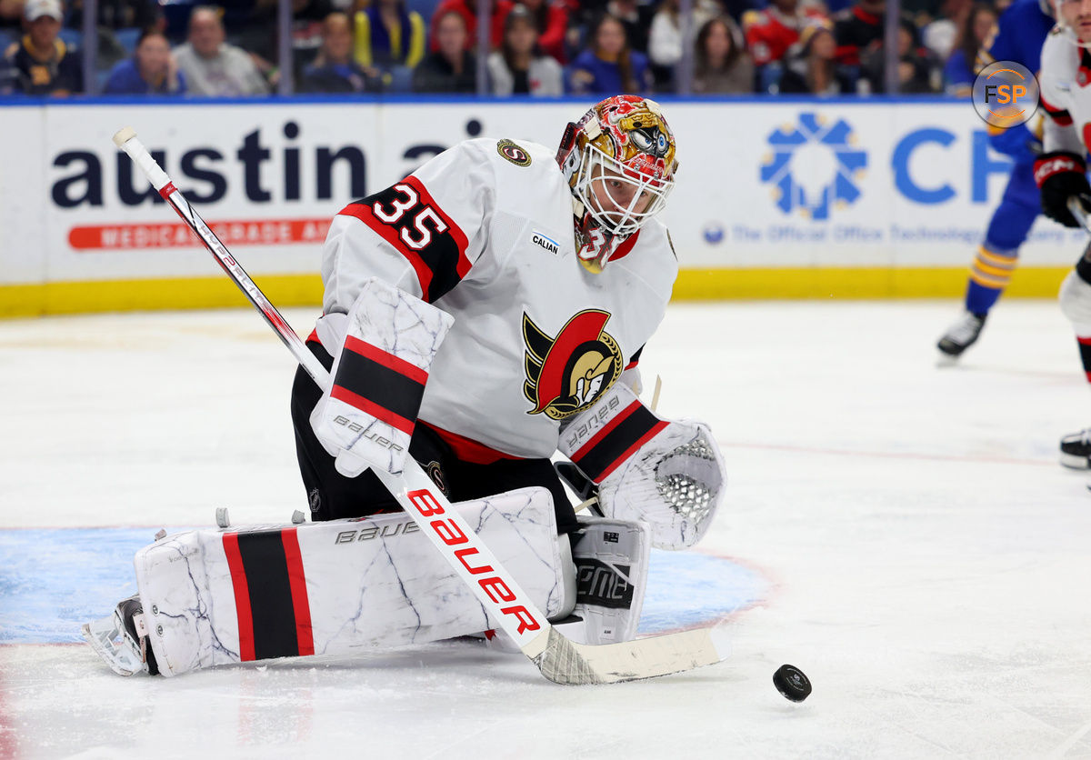 Nov 5, 2024; Buffalo, New York, USA;  Ottawa Senators goaltender Linus Ullmark (35) looks to make a save during the second period against the Buffalo Sabres at KeyBank Center. Credit: Timothy T. Ludwig-Imagn Images