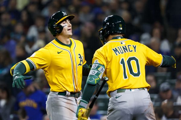 Mar 27, 2025; Seattle, Washington, USA; Athletics first baseman Tyler Soderstrom (21) celebrates with second baseman Max Muncy (10) after hitting a solo-home run against the Seattle Mariners during the fifth inning at T-Mobile Park. Mandatory Credit: Joe Nicholson-Imagn Images
