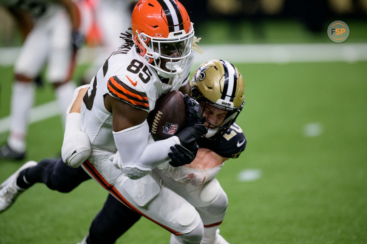 Nov 17, 2024; New Orleans, Louisiana, USA;  Cleveland Browns tight end David Njoku (85) makes a reception against Cleveland Browns running back Pierre Strong Jr. (20) during the second quarter at Caesars Superdome. Credit: Matthew Hinton-Imagn Images