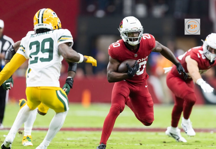 Oct 19, 2025; Glendale, Arizona, USA; Arizona Cardinals running back Bam Knight (20) against the Green Bay Packers in the first half at State Farm Stadium. Credit: Mark J. Rebilas-Imagn Images