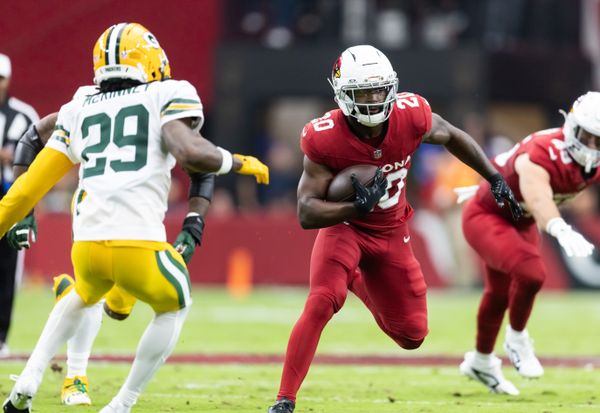 Oct 19, 2025; Glendale, Arizona, USA; Arizona Cardinals running back Bam Knight (20) against the Green Bay Packers in the first half at State Farm Stadium. Mandatory Credit: Mark J. Rebilas-Imagn Images